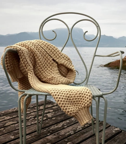 Knit sweater over chain on dock