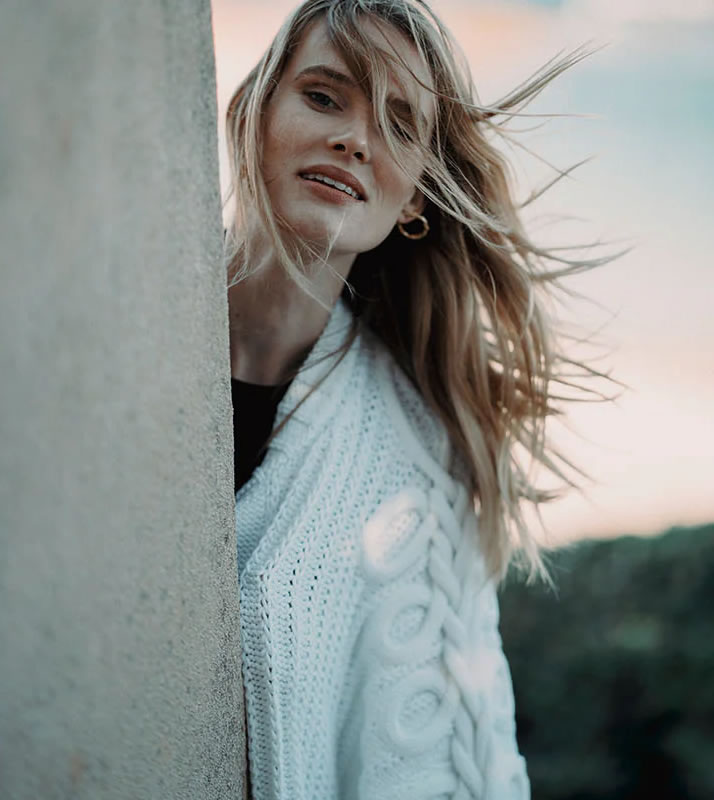 Model with knit white sweater